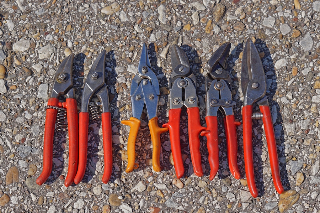 Various sheet metal cutting pliers tools tin snips; essential roofing tools