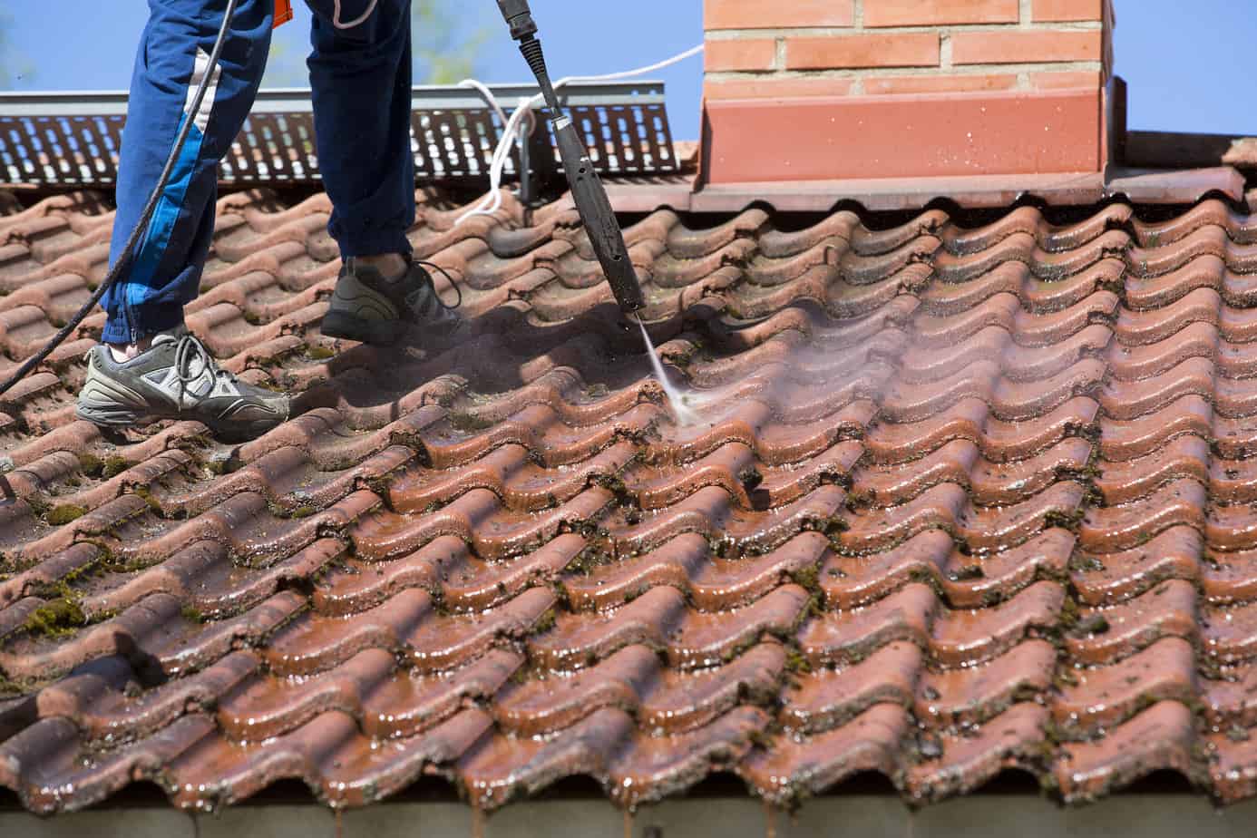 roof cleaning with a high pressure water washer