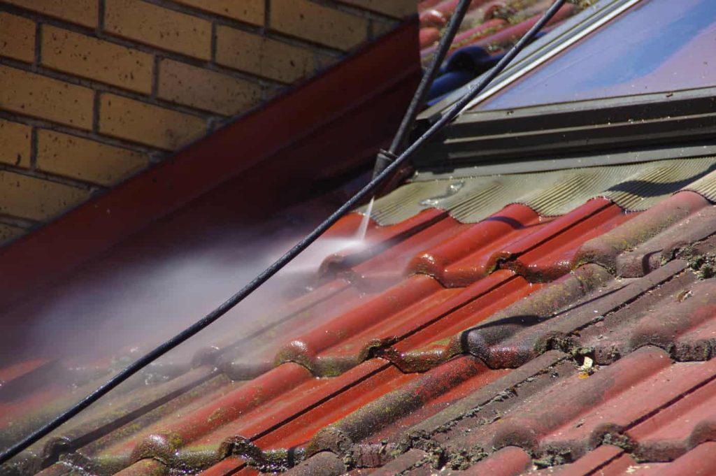 removing roof discoloration with a high-pressure washer; roof cleaning